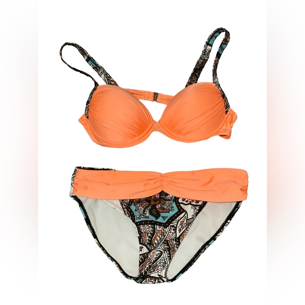 Cute size medium swimsuit! No brand on label but barely worn. Peachy orange